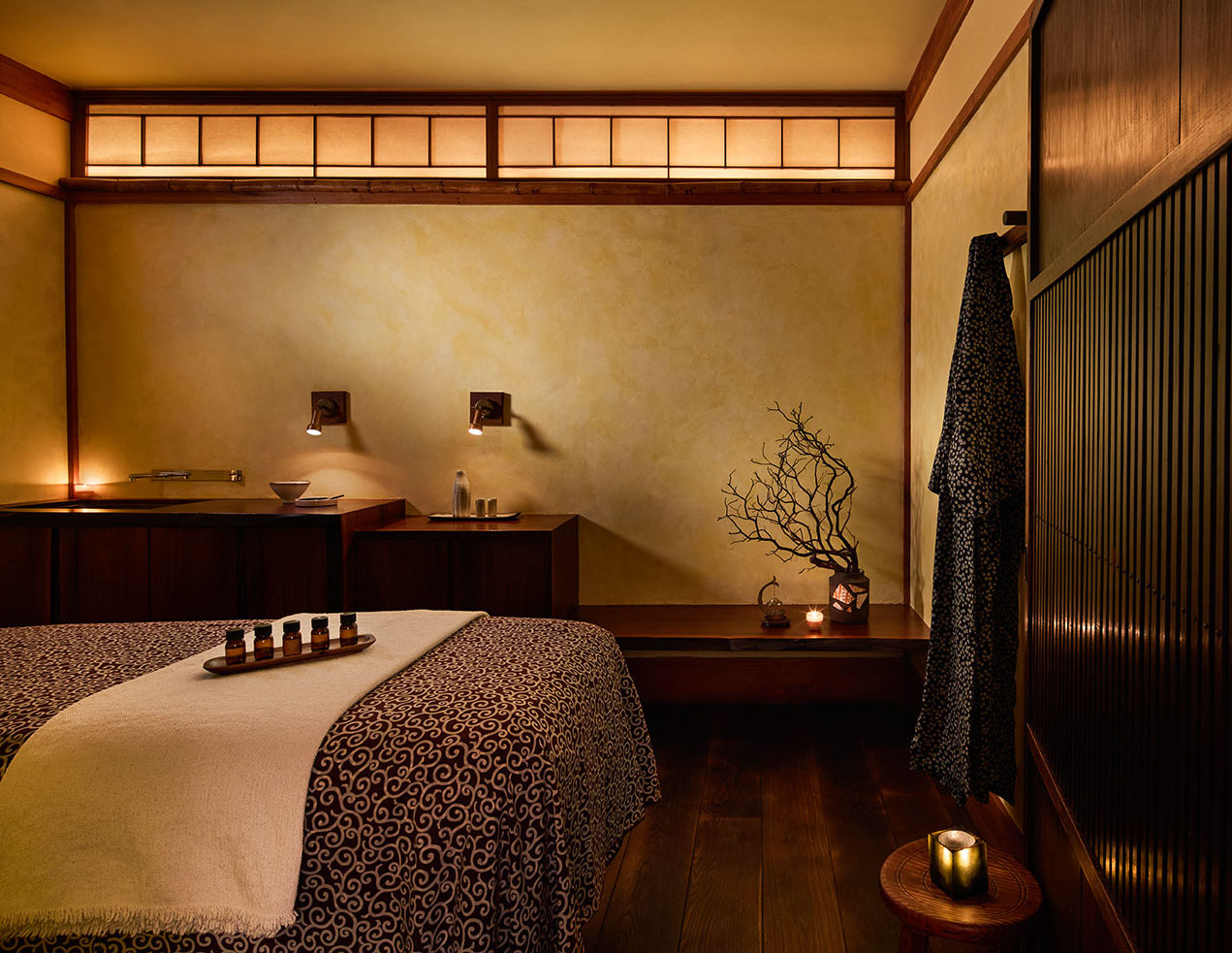 A Shibui Spa treatment room. View of the treatment table/bed, and the earthy decor